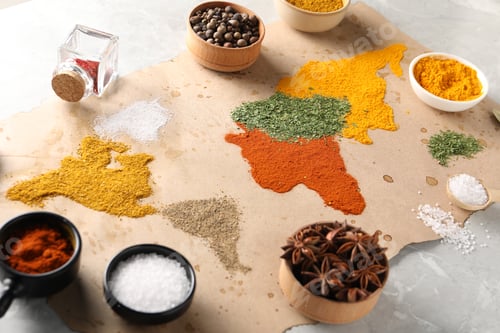 Preview: World map of different spices and products on light grey marble table