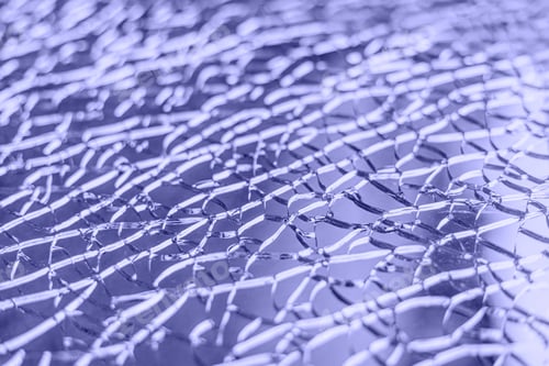 Preview: Close-up of broken glass. Abstract background. Selective focus. Color trend of the year.