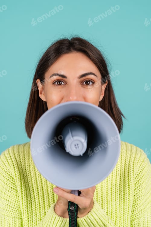 Preview: Young woman in light green sweater with megaphone funny screaming playful