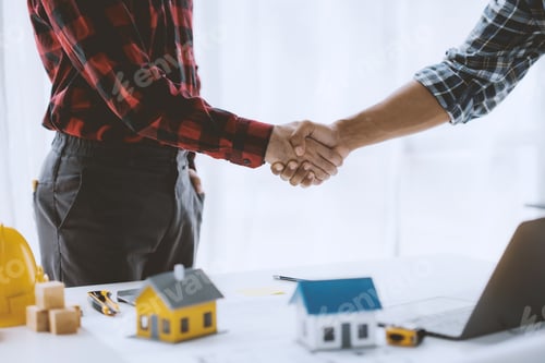 Preview: Engineer and architect handshake agree to work together to achieve success together.