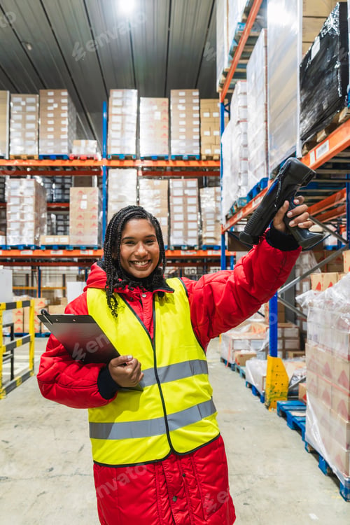 Preview: Woman scanning inventory in cold storage warehouse logistics