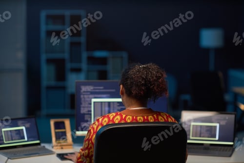 Preview: Woman working on computers in IT office