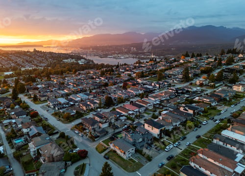 Preview: Aerial Sunset Over Burnaby Suburban Neighborhood With Mountains And Water Near Vancouver