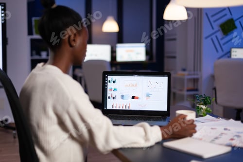 Preview: African american business entrepreneur analyzing financial company graphs