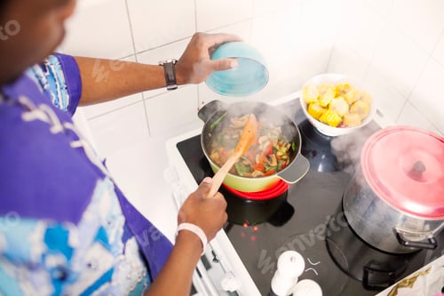Preview: High angle view of man preparing food in kitchen
