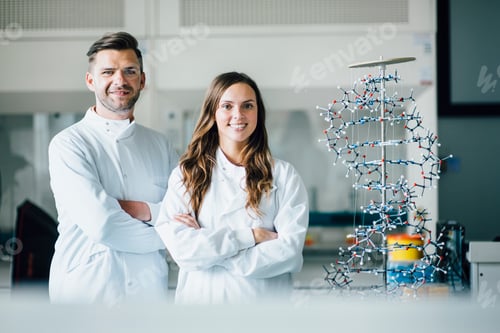 Preview: Scientists standing with arms crossed in a lab