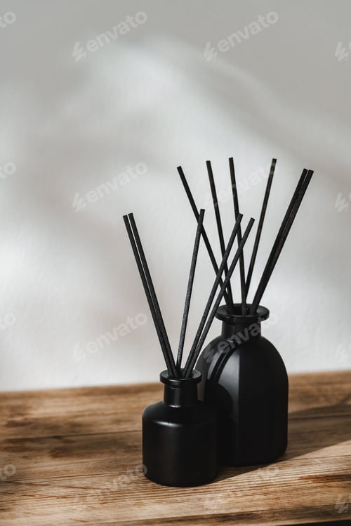 Preview: Minimalist Aromatic Reed Diffusers on a Wooden Surface Against a Soft Background