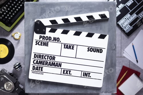 Preview: Movie clapboard or clapper at old table. Clapperboard and screenwriter or movie writer concept