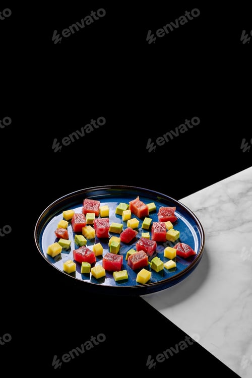 Preview: Vibrant Arrangement of Tuna, Mango, and Avocado Cubes on a Plate