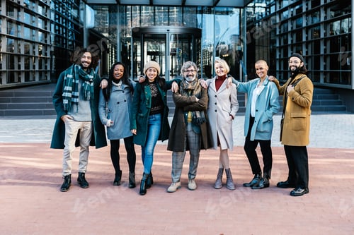 Preview: Portrait of diverse business people team posing over corporate office building