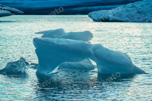 Preview: Abstract pattern of blue iceberg melting and floating in Jokulsarlon glacier lagoon
