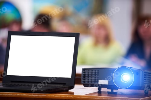 Preview: Working projector at the conference hall. Laptop with white screen. Blurred people at background.