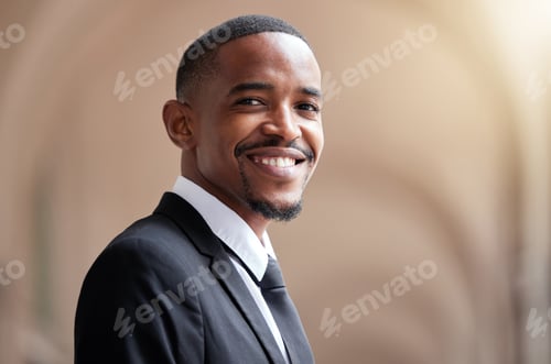 Preview: A smile keeps your spirits high. Shot of a young businessman in the city.