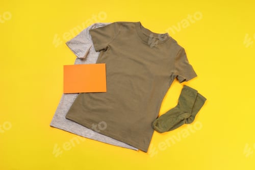 Preview: Blank t-shirts, socks and space for text on yellow background