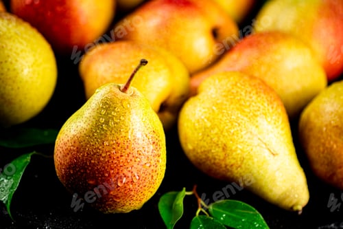 Preview: Pears fresh on a black background.