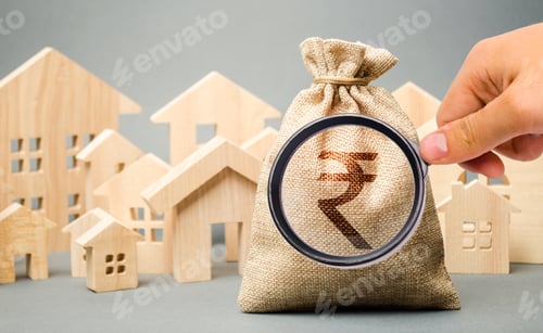 Preview: Money bag with a sign indian rupee (rupiah) and wooden houses