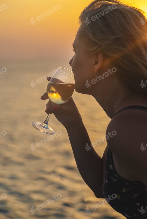 Preview: Drink wine by the sea. Selective focus.