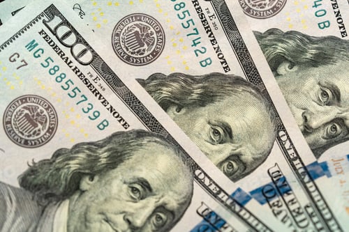 Preview: Top view of 100 dollar bills with the face of Benjamin Franklin