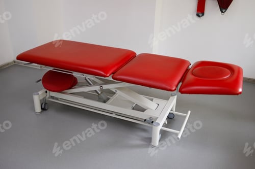 Preview: Red couch in the office of a physiotherapist or rehabilitation doctor