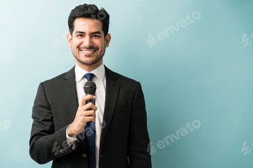Preview: Confident Businessman Giving Speech In Studio