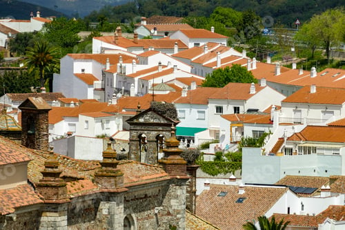 Preview: White and Orange Houses Close One to Another