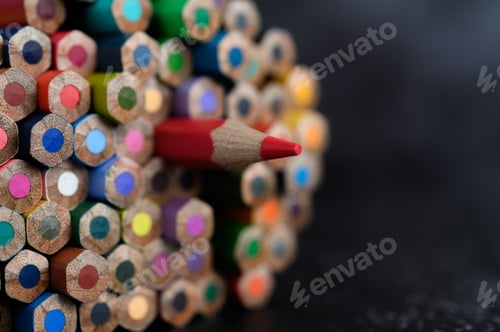 Preview: Closeup with a group of colored pencils, selected focus, red