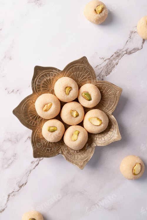 Preview: Traditional indian sweets burfi on marble background