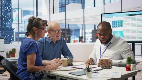 Preview: Financial planner helping senior couple with various retirement strategy