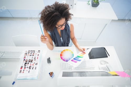 Preview: Pretty Designer Working At Her Desk In Her Office