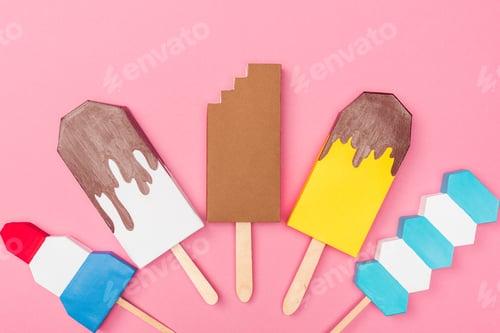 Preview: top view of handmade colorful origami ice cream isolated on pink
