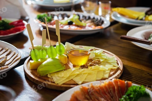 Preview: Cheese plate on a table with different dishes