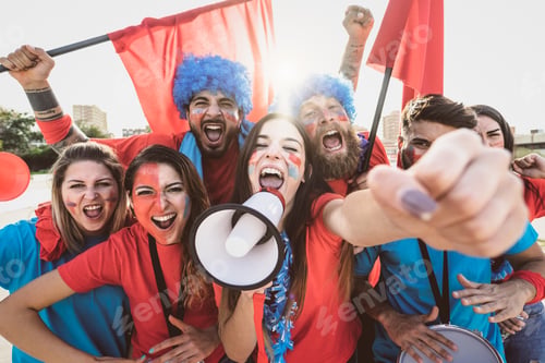 Preview: Football fans watching soccer match event at stadium