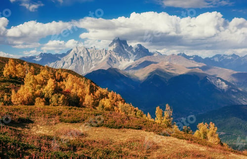 Preview: Magic autumn landscape and snow-capped mountain peaks