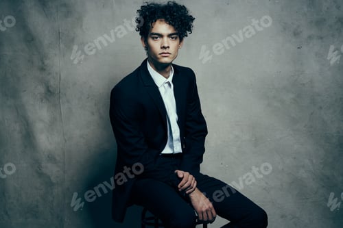 Preview: business man in a suit sitting on a chair fashion modern style Professional