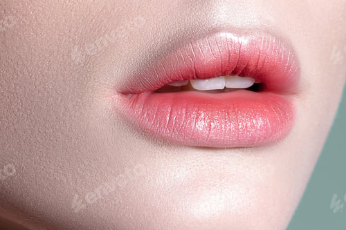 Preview: Lips of young sensual woman with clear glowing skin closeup