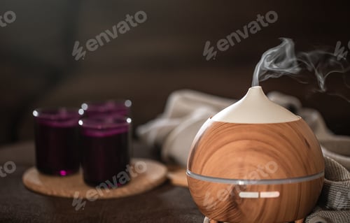 Preview: Modern oil aroma diffuser wiht decor details copy space.