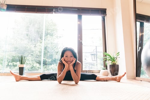 Preview: Japanese woman performing Yoga with help of personal trainer