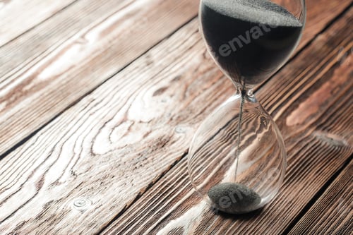 Preview: Modern hourglass on wooden background