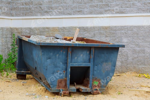 Preview: Industrial dumpster filled Loaded dumpster near a construction site, home renovation