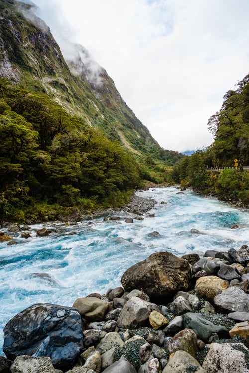 Preview: Small river flowing through the rocks and mountains in Milford Sounds, New Zealand