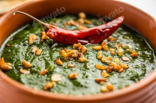 Preview: lasooni palak recipe or dhaba style garlic spinach curry, Indian main course served with naan