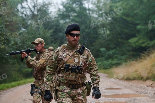 Preview: A disciplined and specialized military unit, donned in camouflage, strategically patrolling and