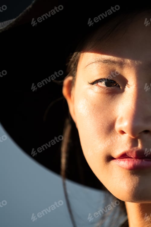Preview: half face portrait of a young oriental woman