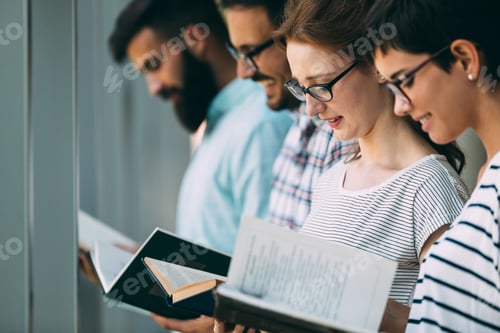 Preview: Group of college students studying at library
