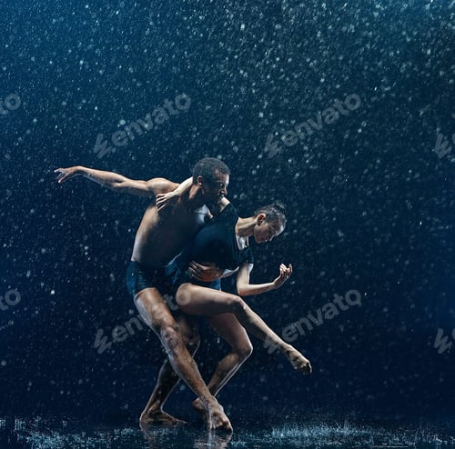 Preview: Young couple of ballet dancers dancing unde rwater drops