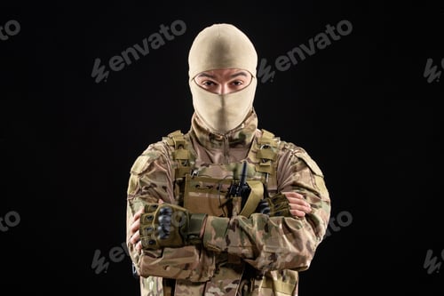 Preview: front view of young soldier in uniform on black background palestine warrior tank