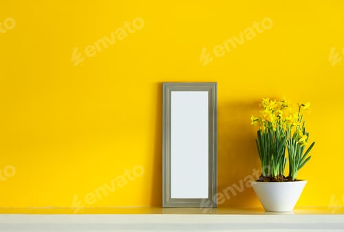 Preview: Yellow daffodils and a gray photoframe