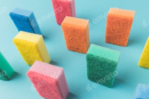 Preview: studio shot of colorful washing kitchen sponges, on blue