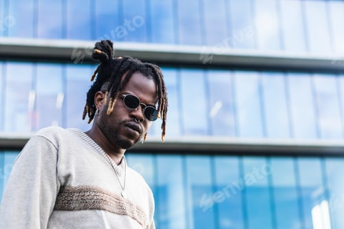 Preview: Cool black guy with dreadlocks in city center