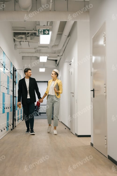 Preview: Couple is holding hands walking along corridor